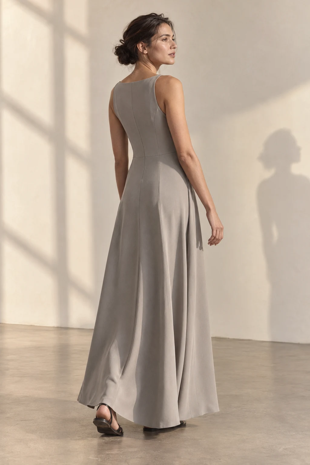 AI-generated editorial: back view of an oyster-grey dress in natural light