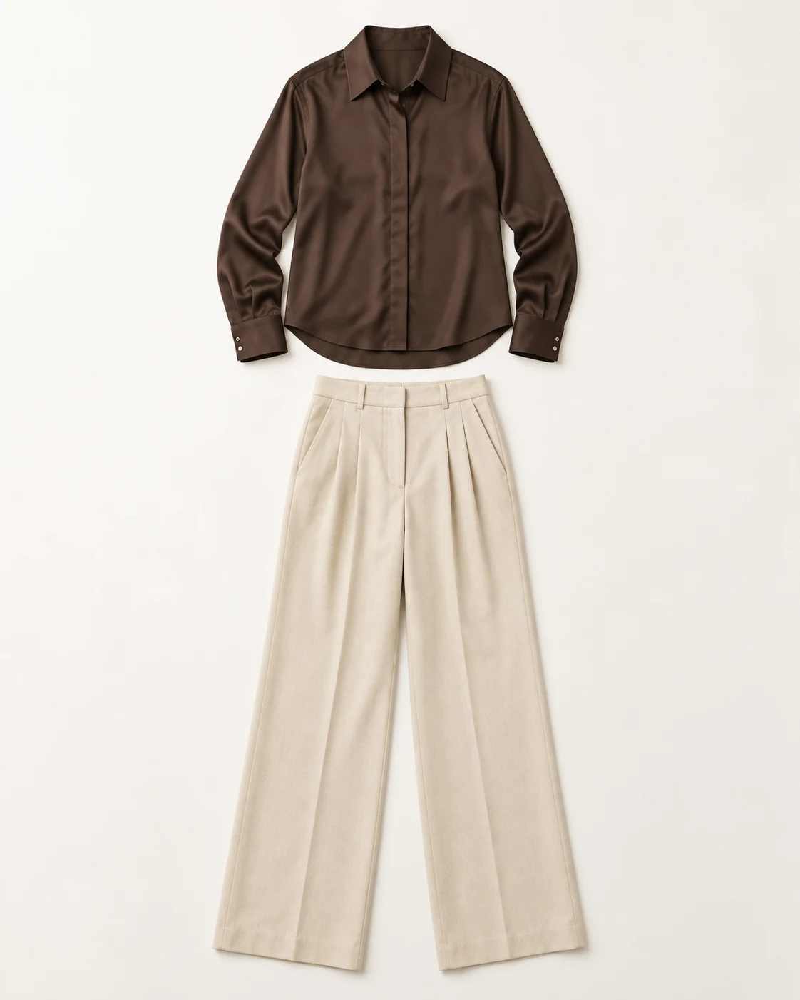 A brown shirt and ivory trousers photographed flat, two pieces for the rail